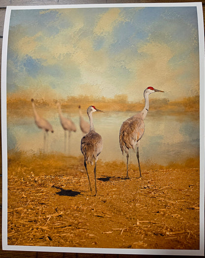 Artistic depiction of cranes on a textured surface with abstract background
