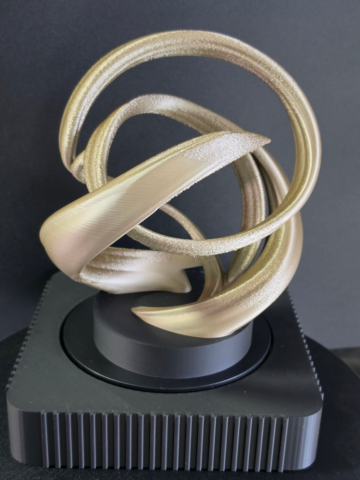 Square Rotating Art Display with Gold Sculpture