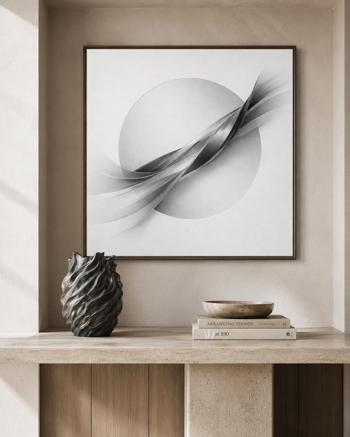 Abstract art piece on a wall above a shelf with decorative items.